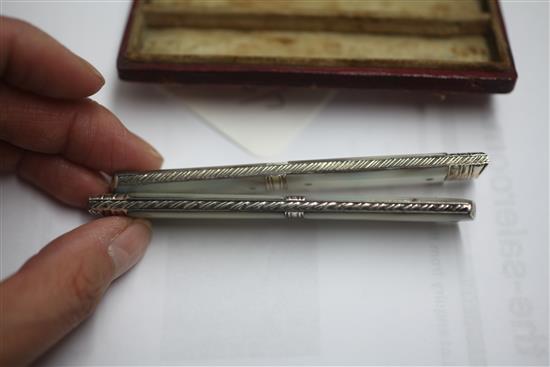 A cased Georgian silver and mother of pearl folding travelling fruit knife and fork,